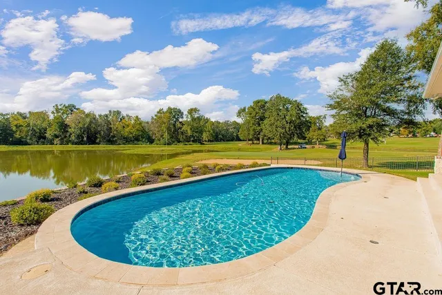 a view of a swimming pool and lake