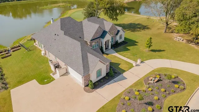 an aerial view of a house with swimming pool