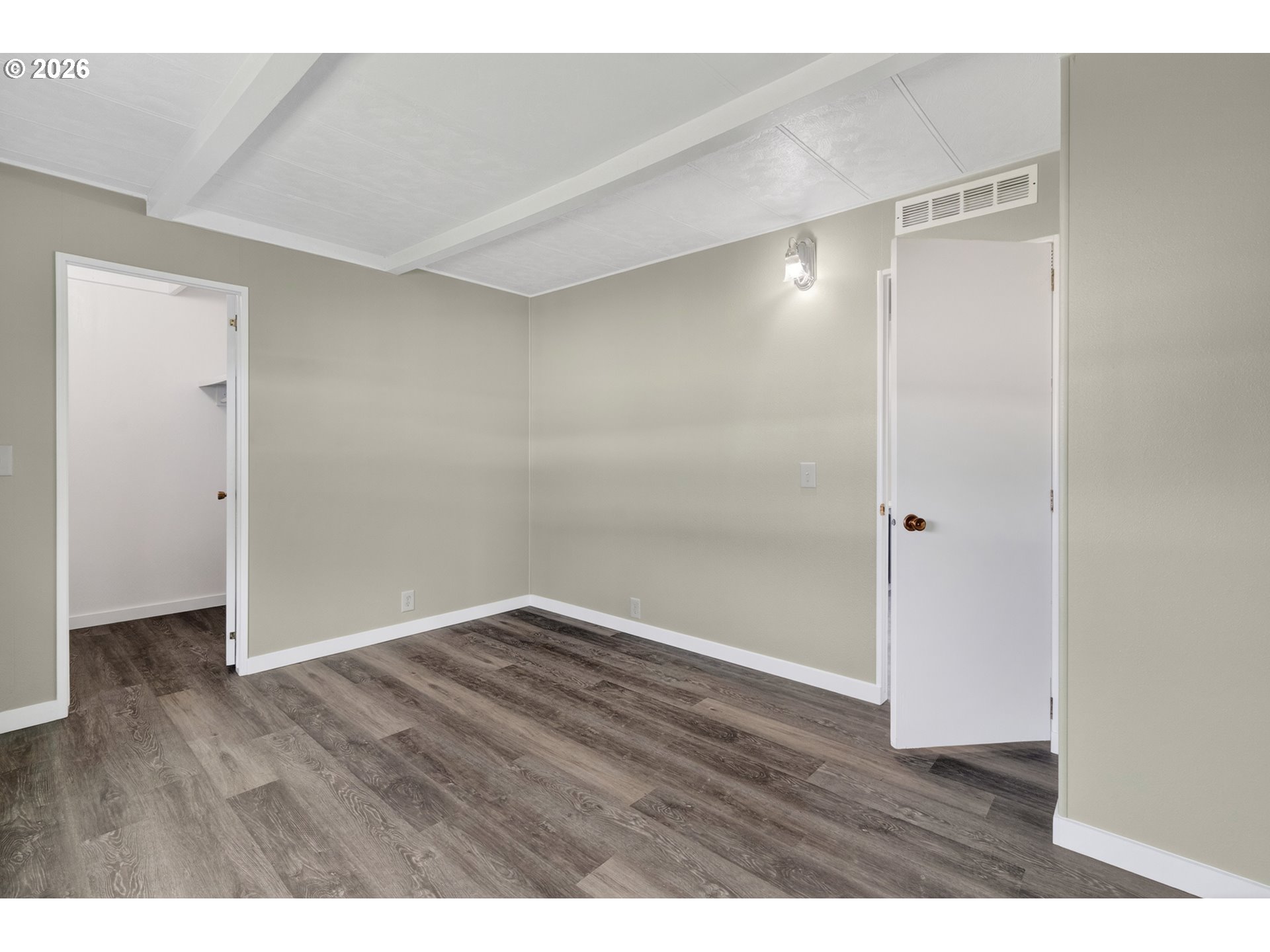 205 South 54th Street, Unit 20 Springfield, OR 97478 - Photo 14 of 32 a view of an empty room with wooden floor