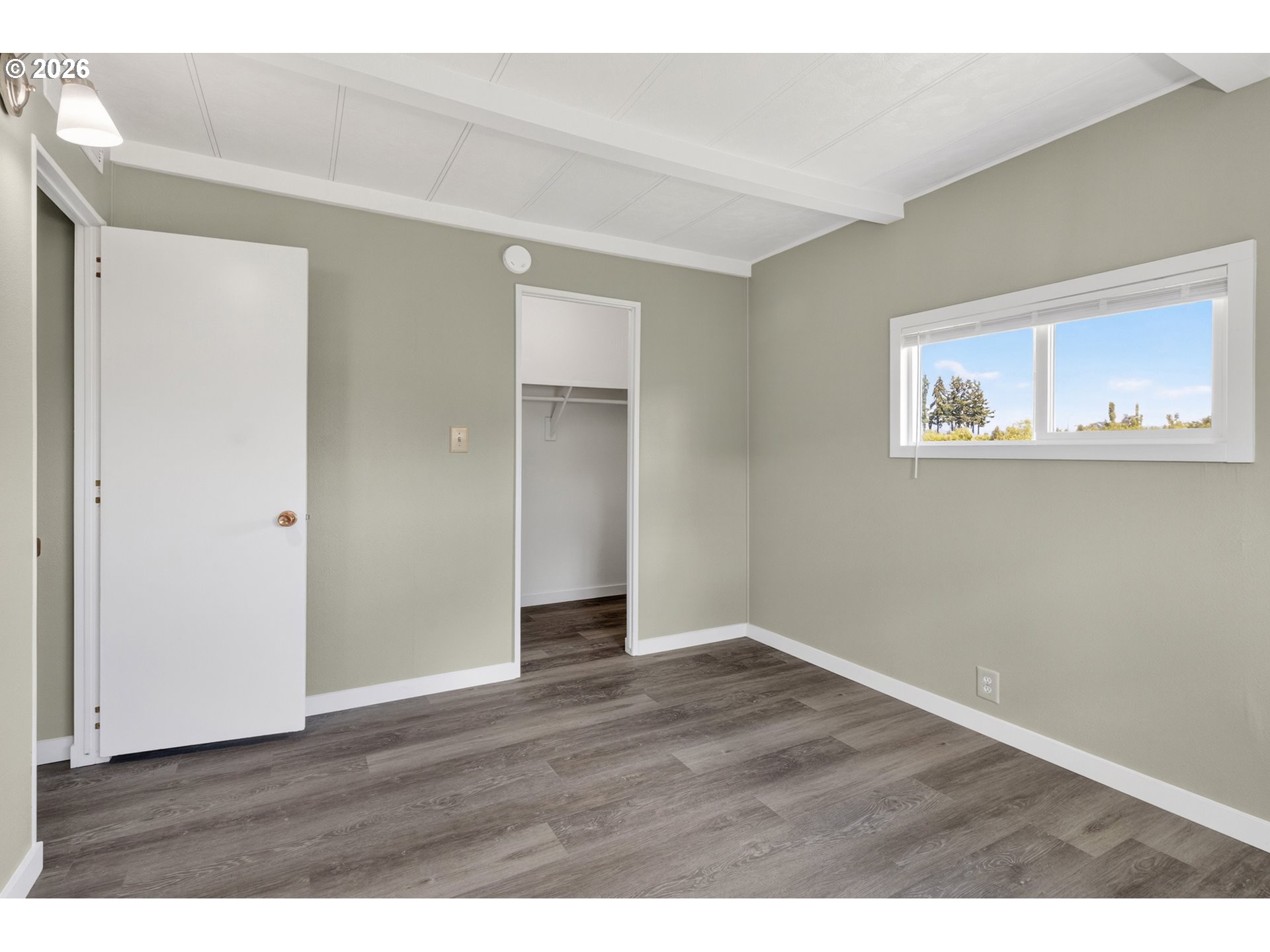 205 South 54th Street, Unit 20 Springfield, OR 97478 - Photo 20 of 32 a view of an empty room with wooden floor