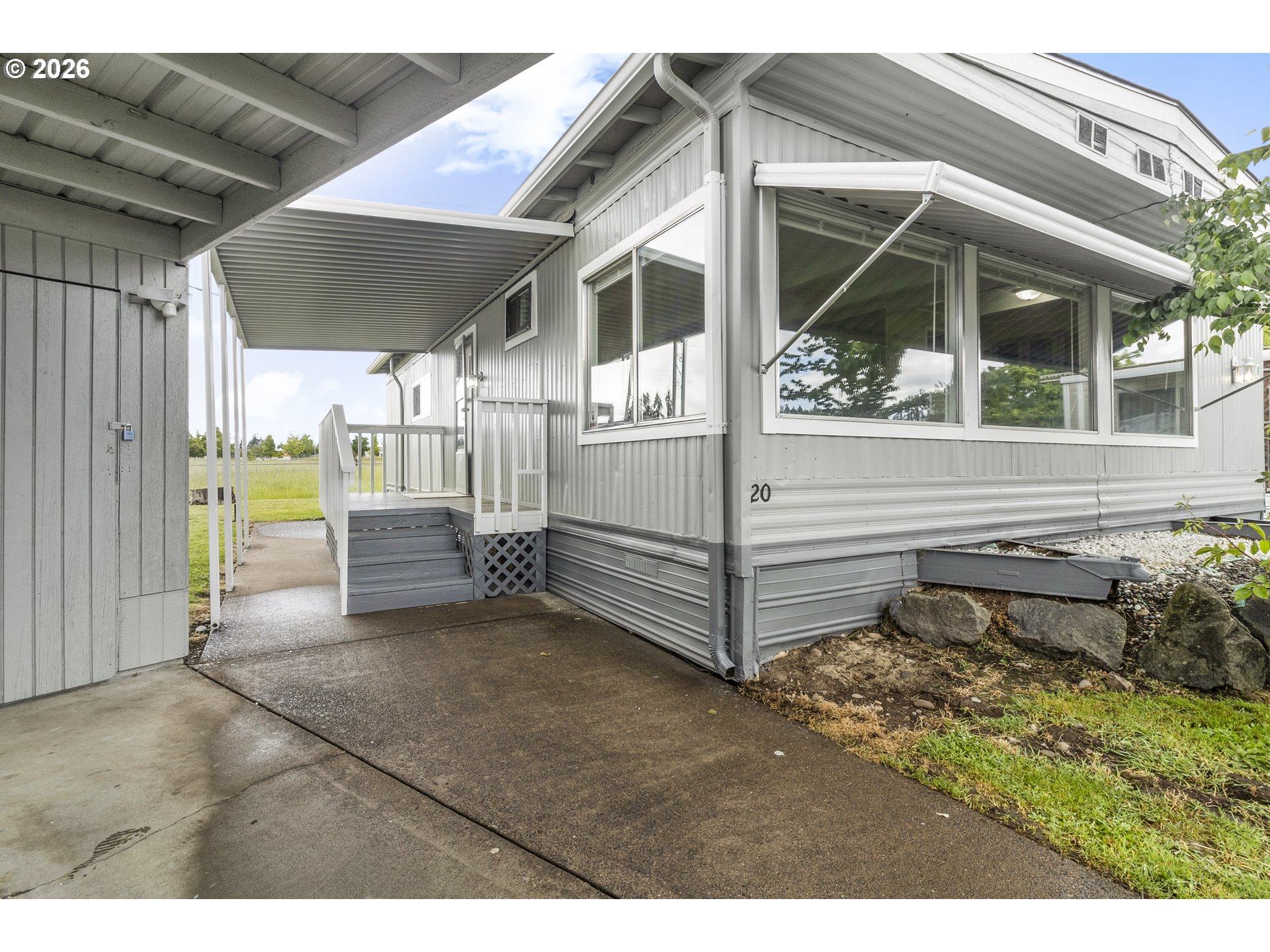 205 South 54th Street, Unit 20 Springfield, OR 97478 - Photo 23 of 32 a view of a house with backyard and porch