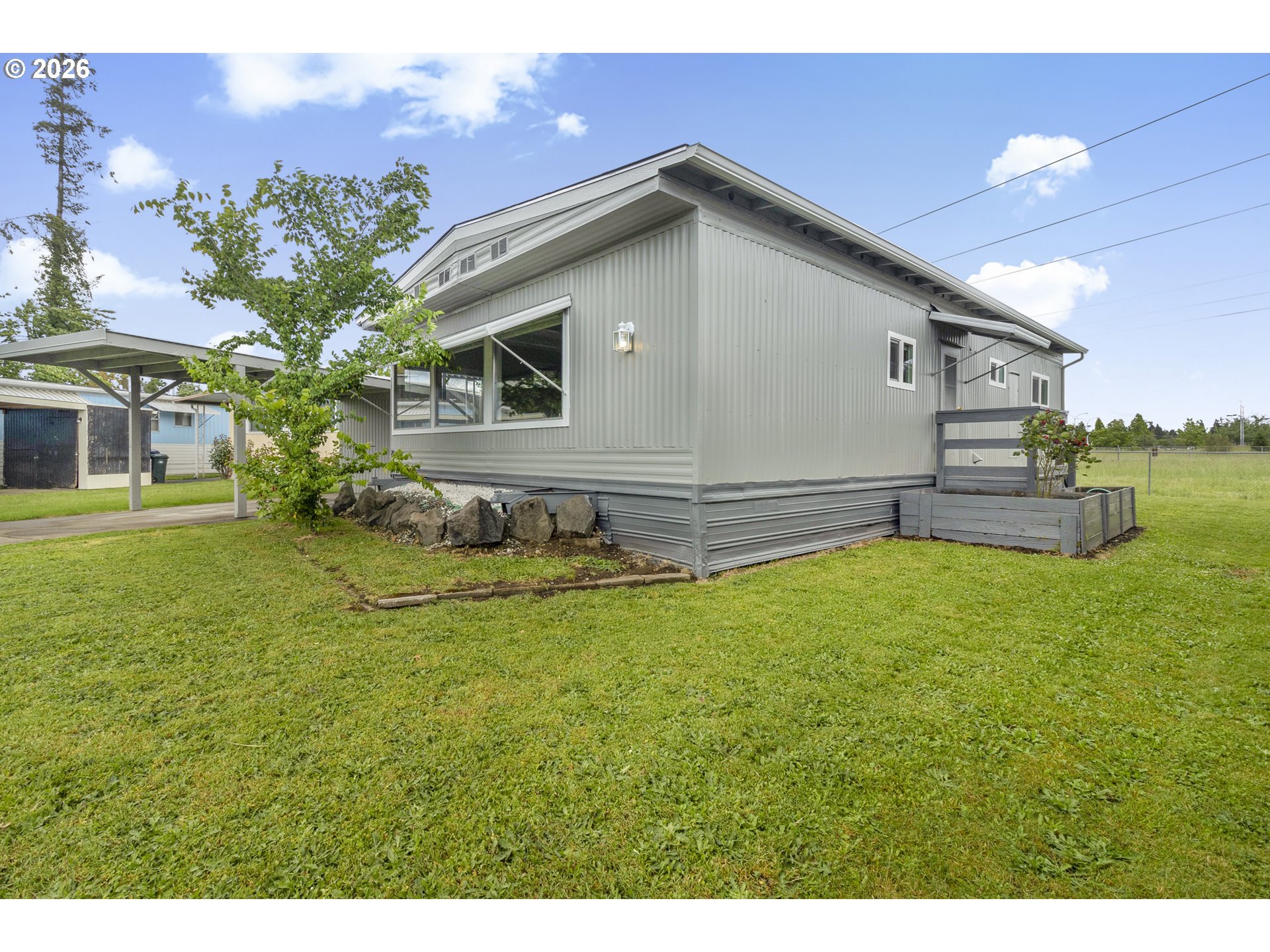 205 South 54th Street, Unit 20 Springfield, OR 97478 - Photo 26 of 32 a view of a house with a yard