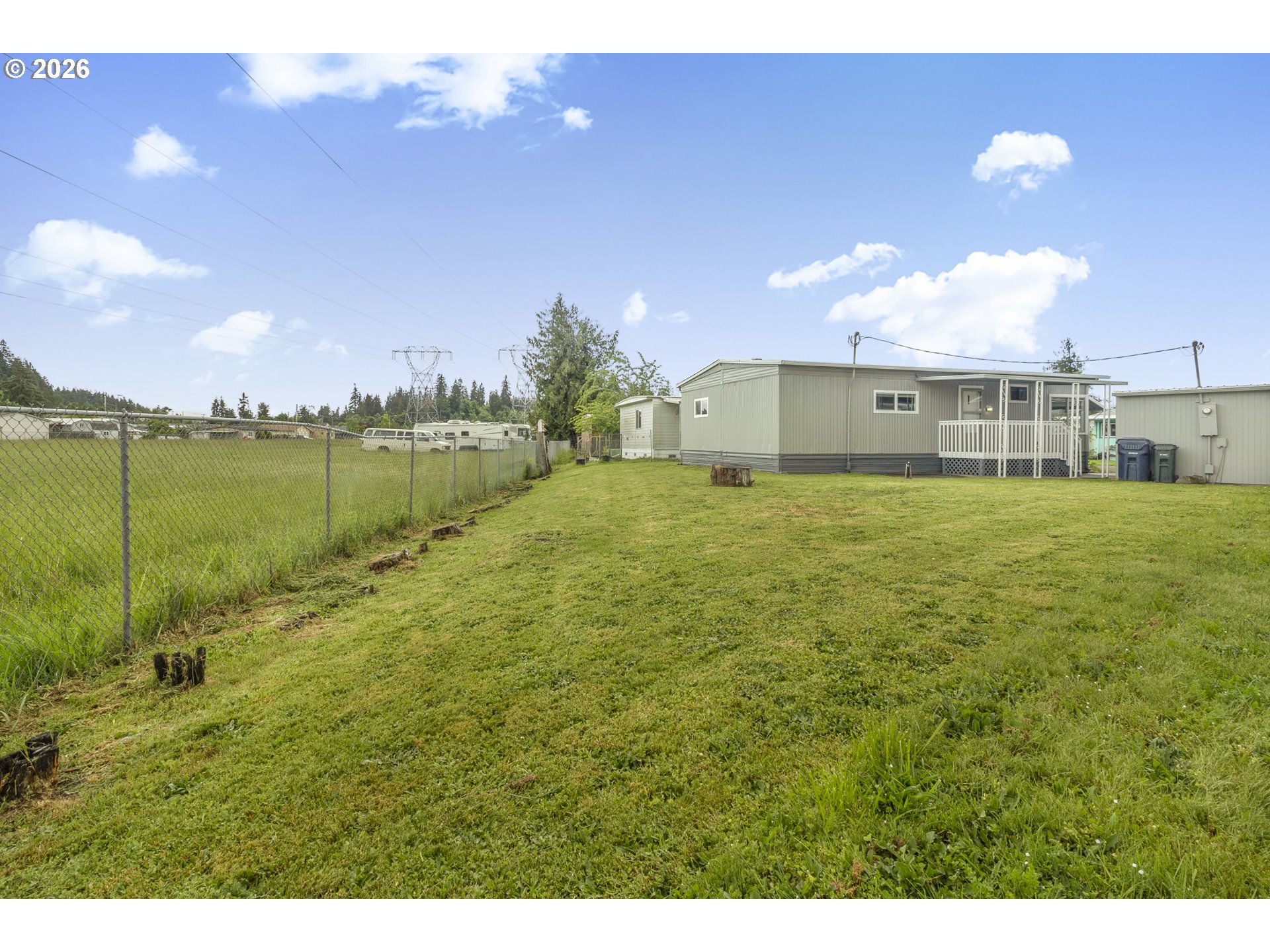 205 South 54th Street, Unit 20 Springfield, OR 97478 - Photo 28 of 32 a view of a big yard with a house