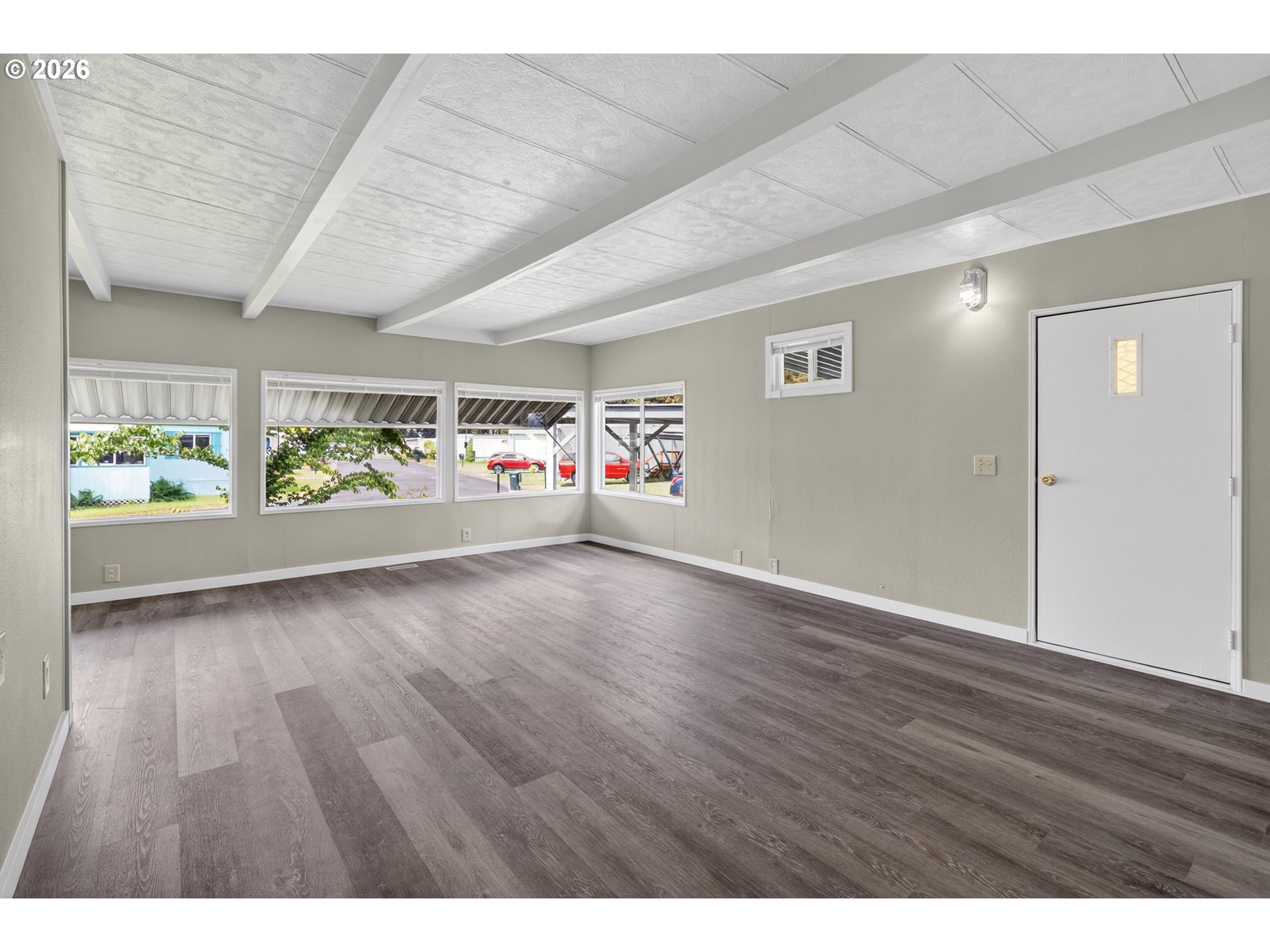 205 South 54th Street, Unit 20 Springfield, OR 97478 - Photo 3 of 32 a view of an empty room with wooden floor