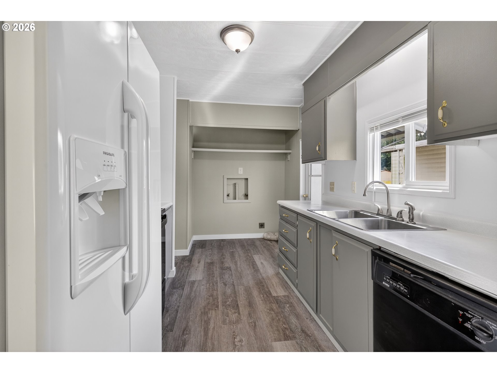 205 South 54th Street, Unit 20 Springfield, OR 97478 - Photo 8 of 32 a kitchen with a sink and refrigerator