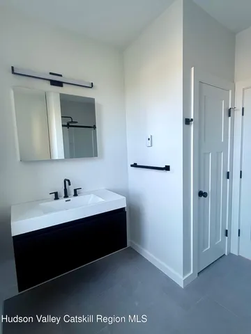 a view of bathroom with dual sinks