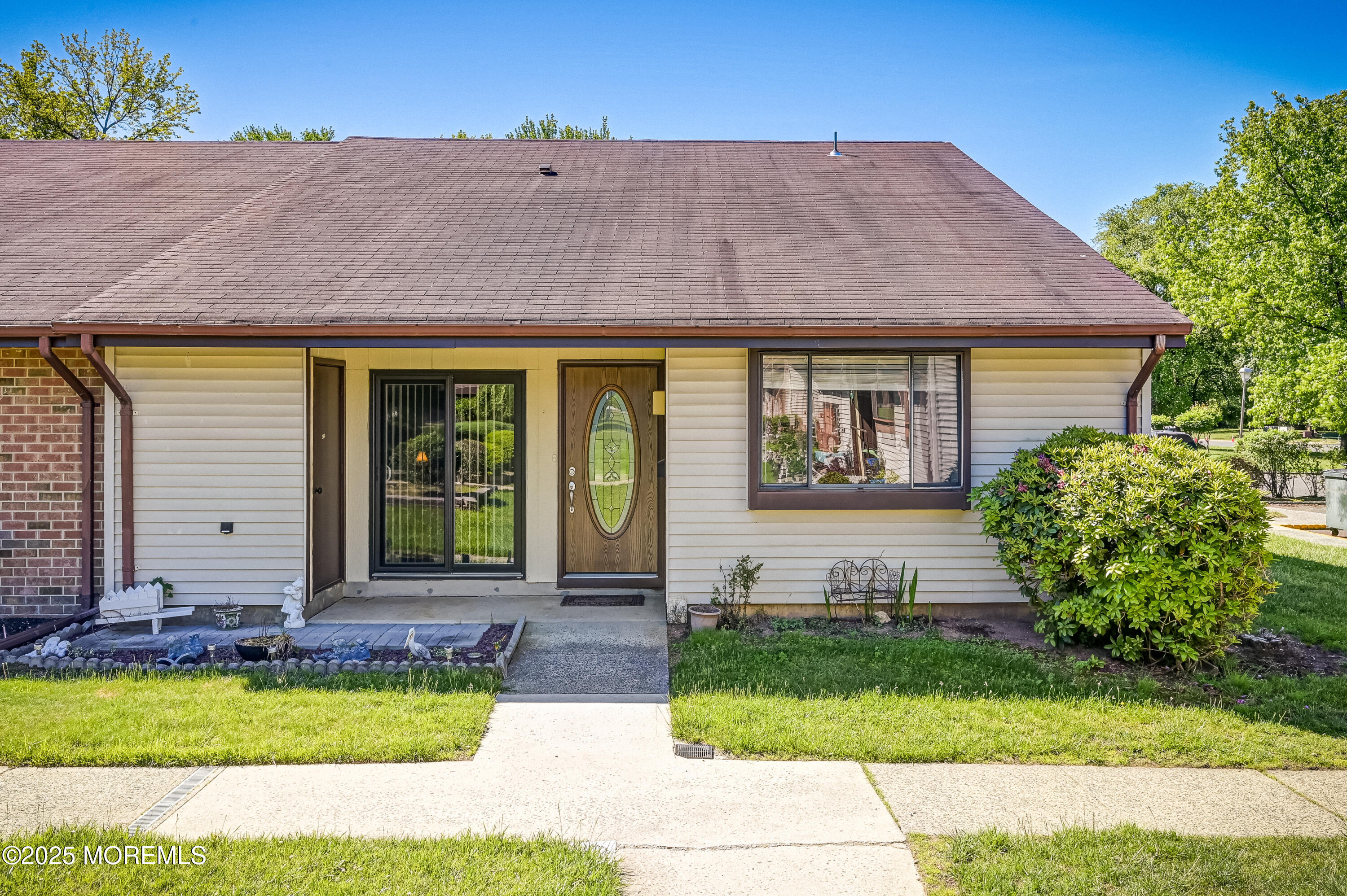 a front view of a house with garden