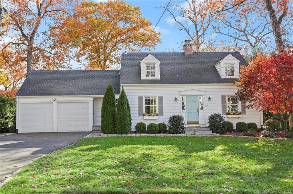 131 Harwich Road Fairfield, CT 06825 - Photo 1 of 1 a front view of a house with a garden and plants