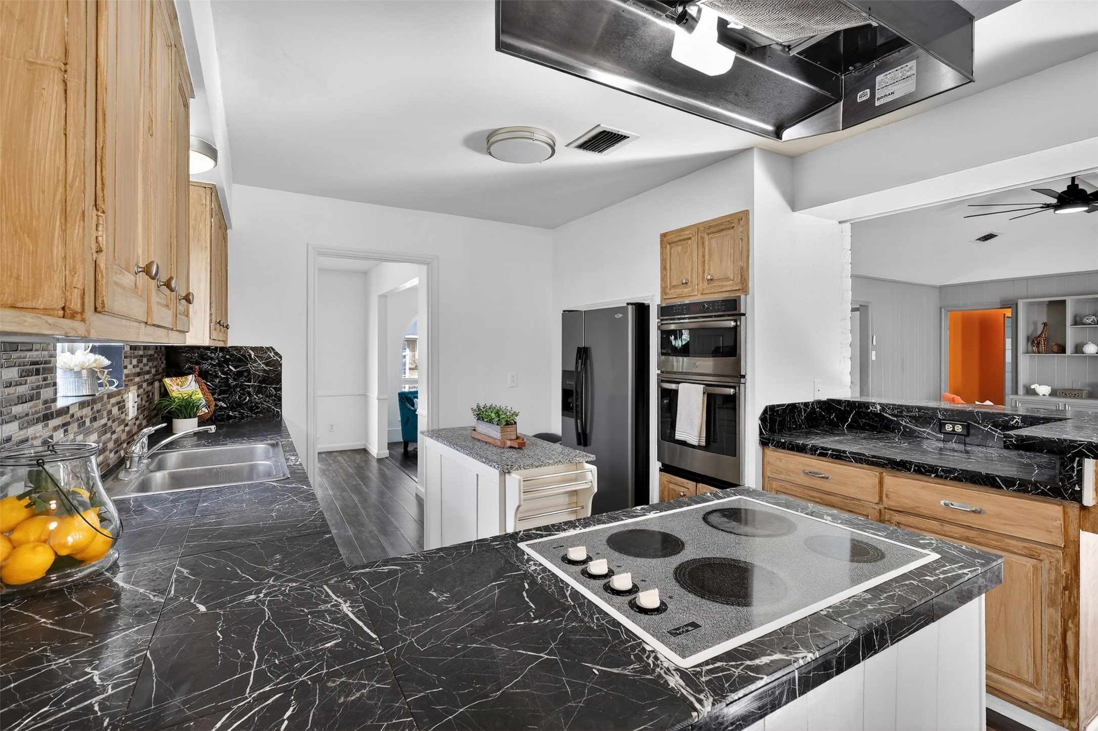 2519 Anniston Drive Houston, TX 77080 - Photo 11 of 39 a living room with stainless steel appliances furniture a rug and a window