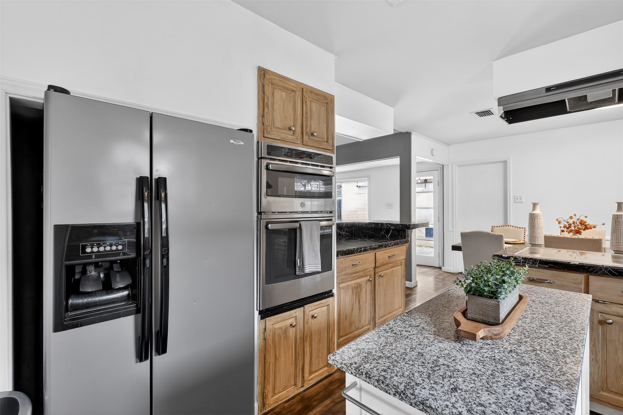 2519 Anniston Drive Houston, TX 77080 - Photo 12 of 39 a kitchen with stainless steel appliances granite countertop a refrigerator a stove and a refrigerator