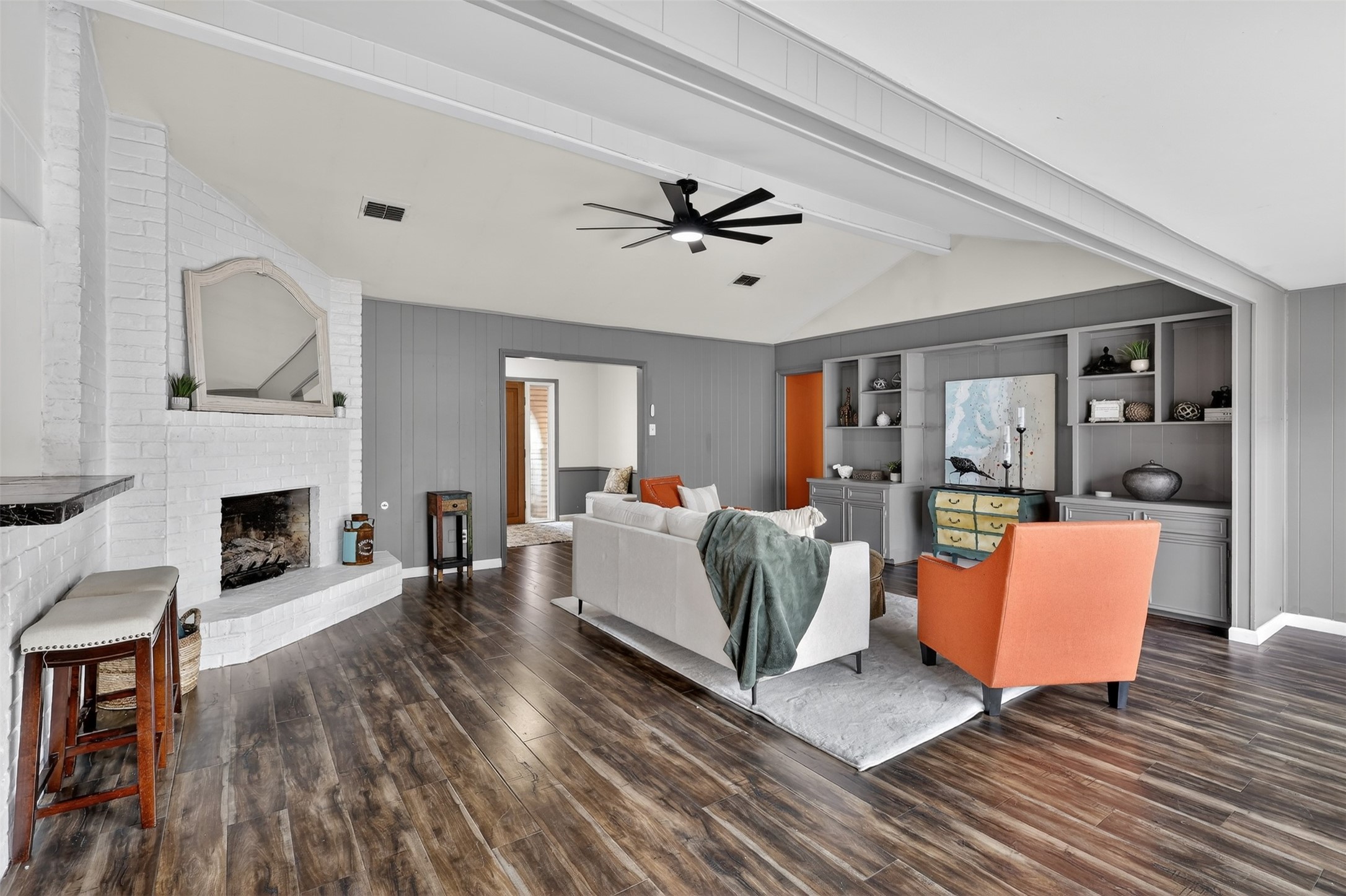 2519 Anniston Drive Houston, TX 77080 - Photo 14 of 39 a living room with furniture a fireplace and a ceiling fan