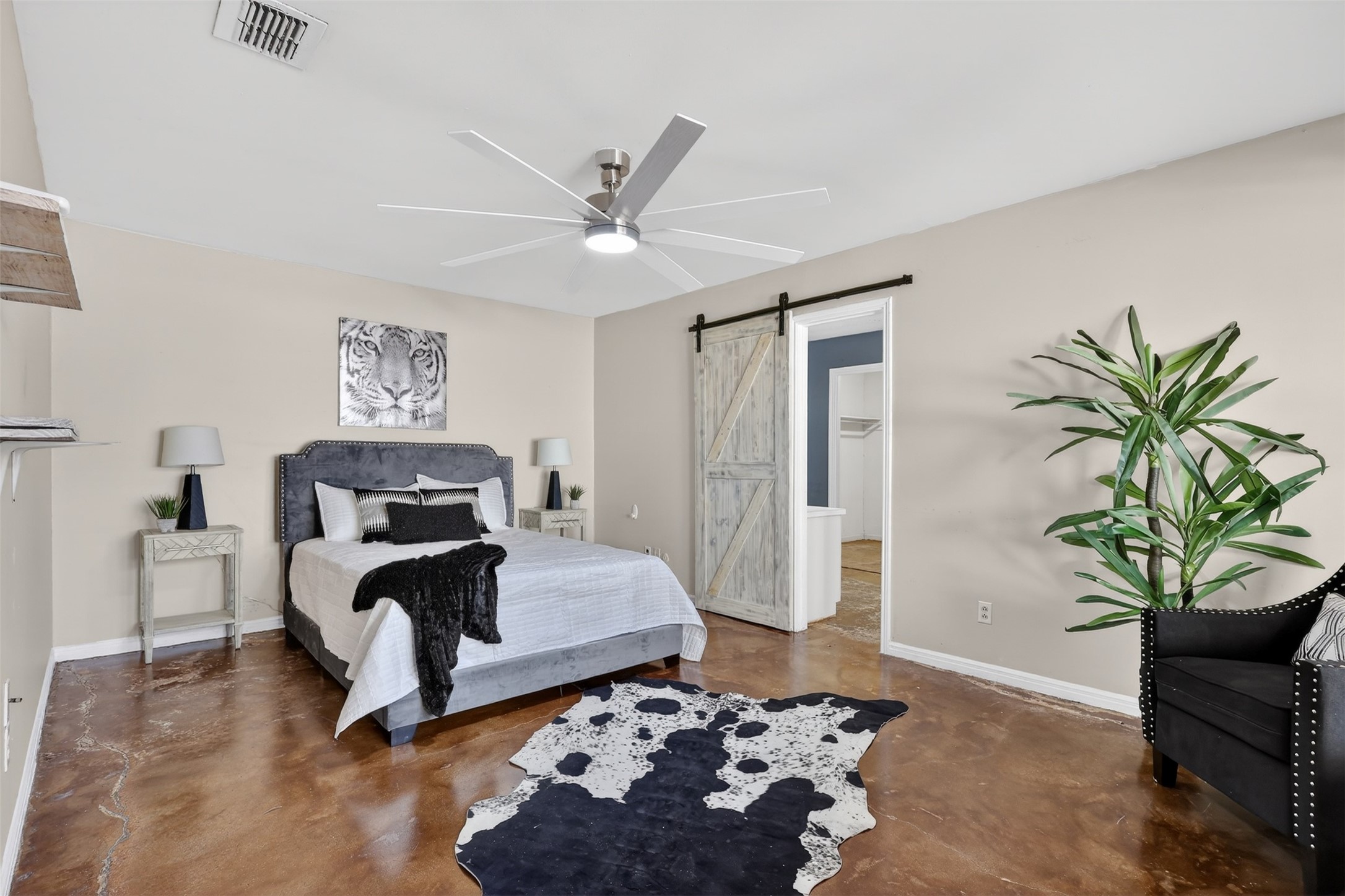 2519 Anniston Drive Houston, TX 77080 - Photo 17 of 39 a bedroom with a bed and a potted plant