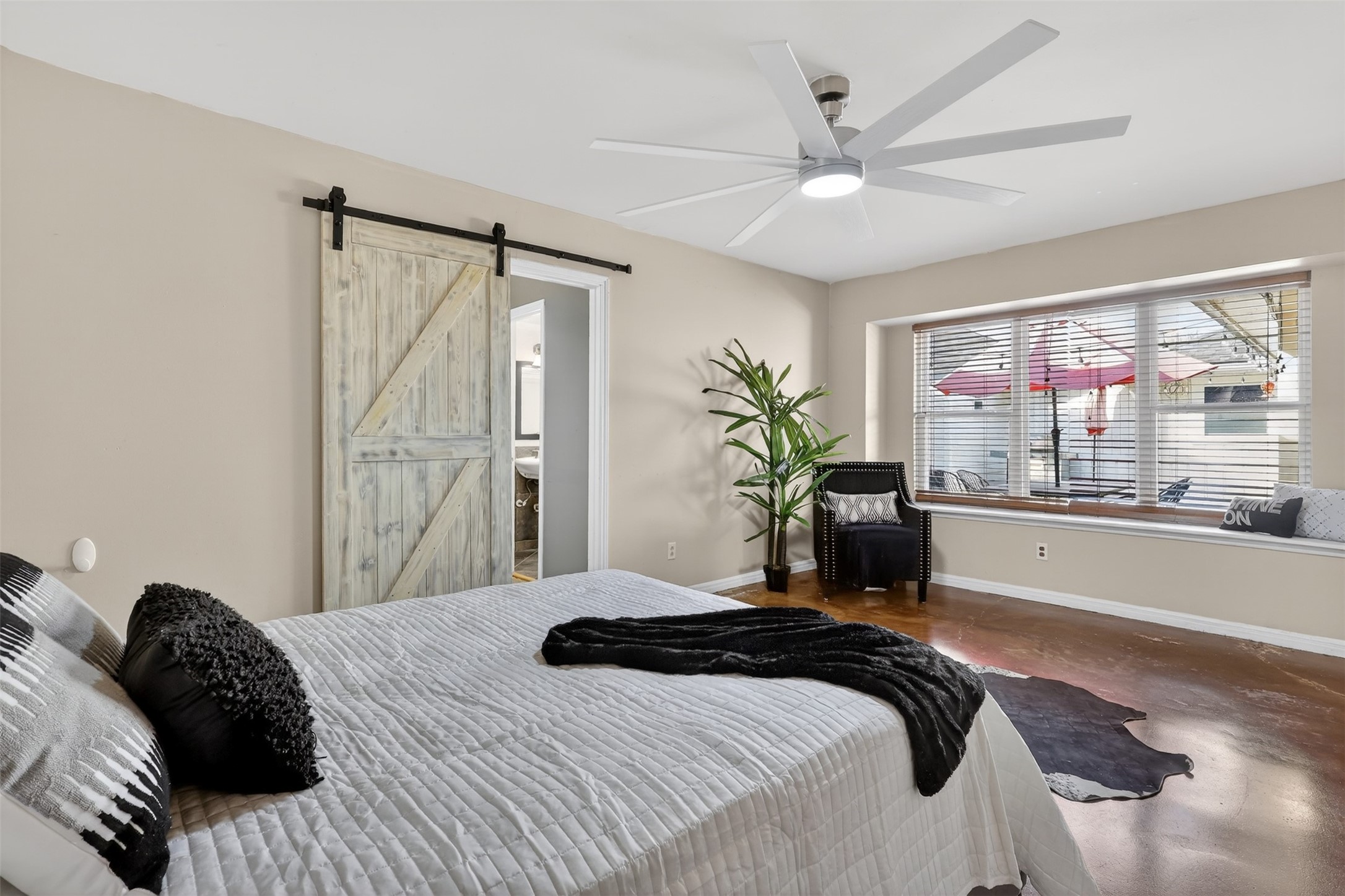 2519 Anniston Drive Houston, TX 77080 - Photo 18 of 39 a bedroom with a large bed and a large window