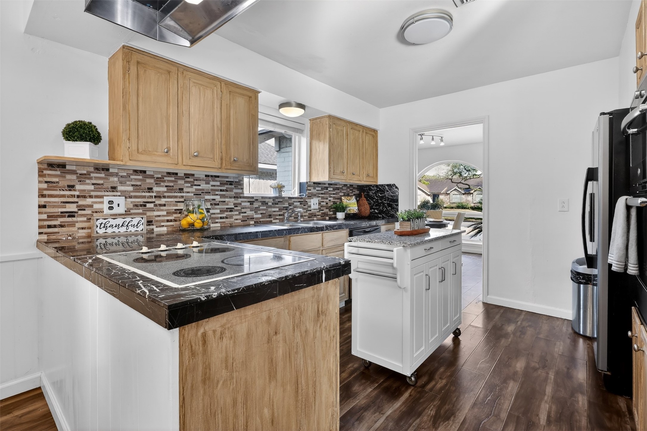 2519 Anniston Drive Houston, TX 77080 - Photo 10 of 39 a kitchen with stainless steel appliances granite countertop a stove a sink dishwasher and a refrigerator