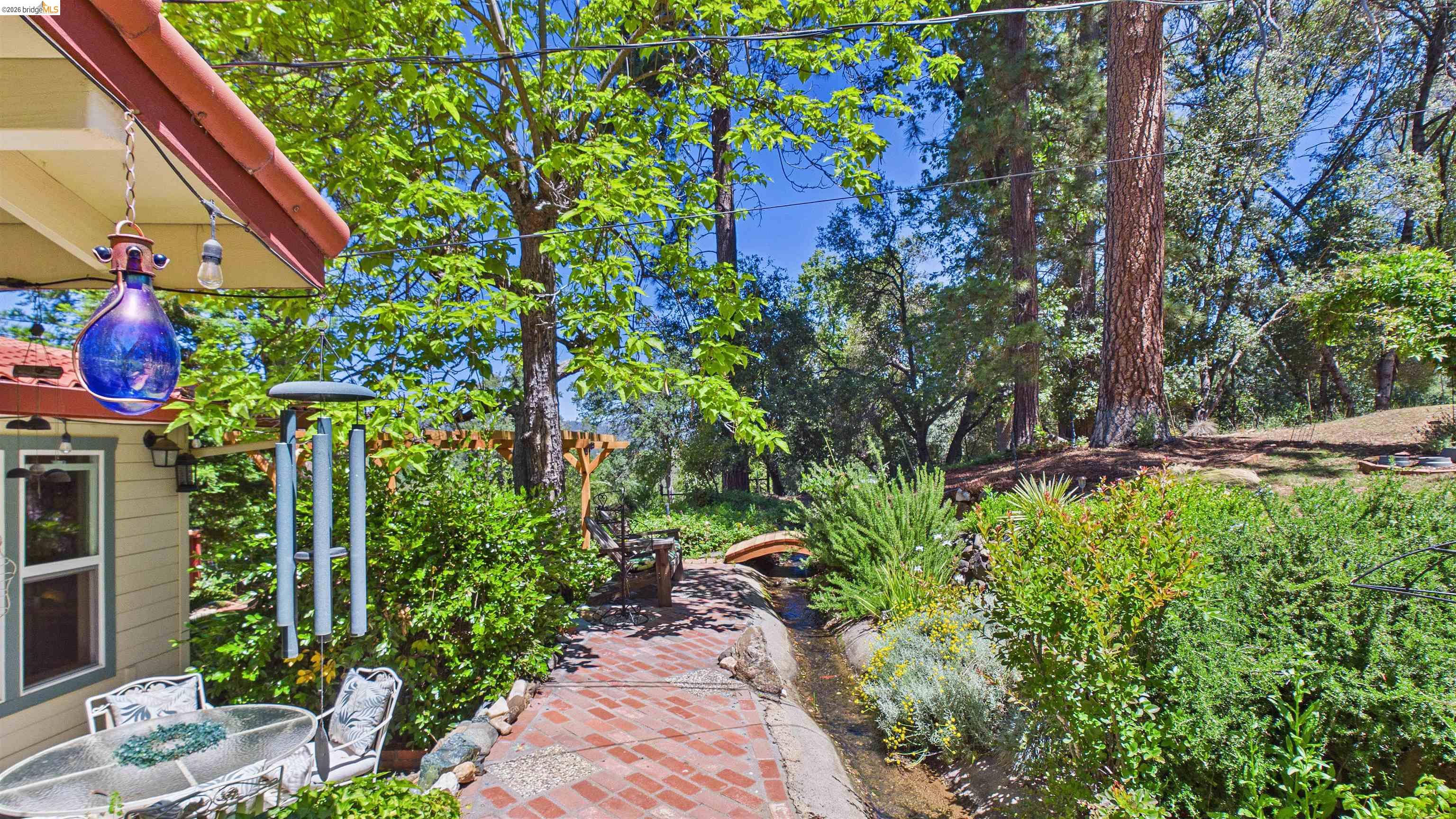 18102 Mt Eaton Road Tuolumne, CA 95379 - Photo 33 of 44 Outdoor patio with brick-finish paving and mature landscaping