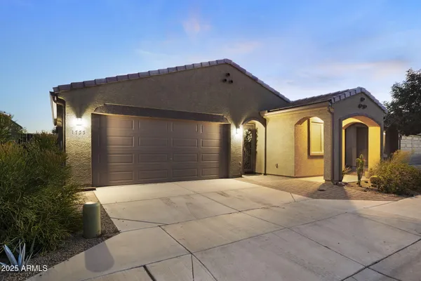 a front view of a house with a garage