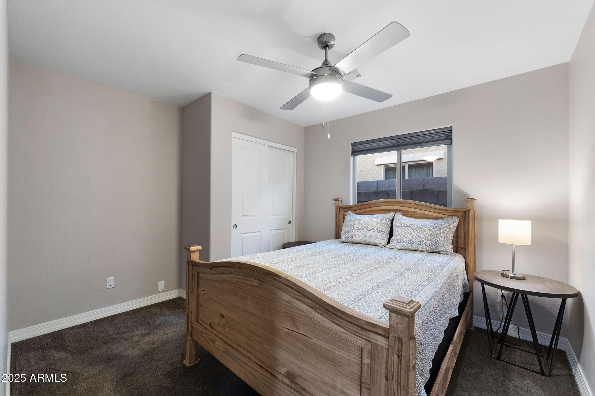 1755 East Mesquite Avenue Apache Junction, AZ 85119 - Photo 12 of 17 a bedroom with a bed and window