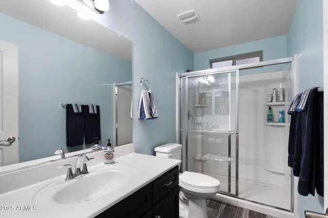 a utility room with cabinets washer and dryer