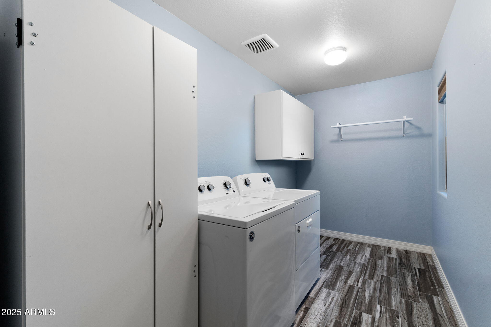 1755 East Mesquite Avenue Apache Junction, AZ 85119 - Photo 14 of 17 a utility room with cabinets washer and dryer