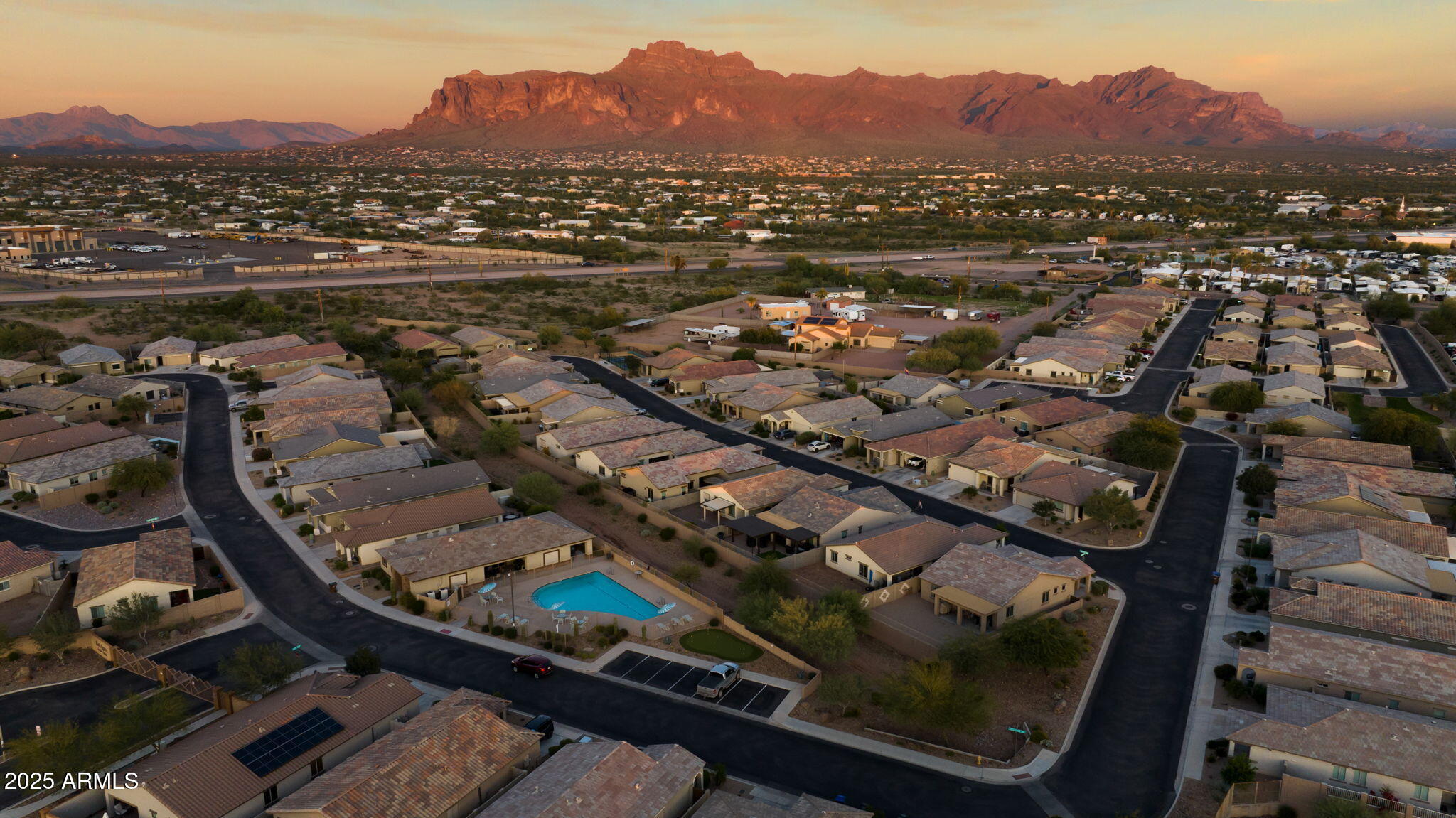 1755 East Mesquite Avenue Apache Junction, AZ 85119 - Photo 2 of 17 an aerial view of residential houses and outdoor space