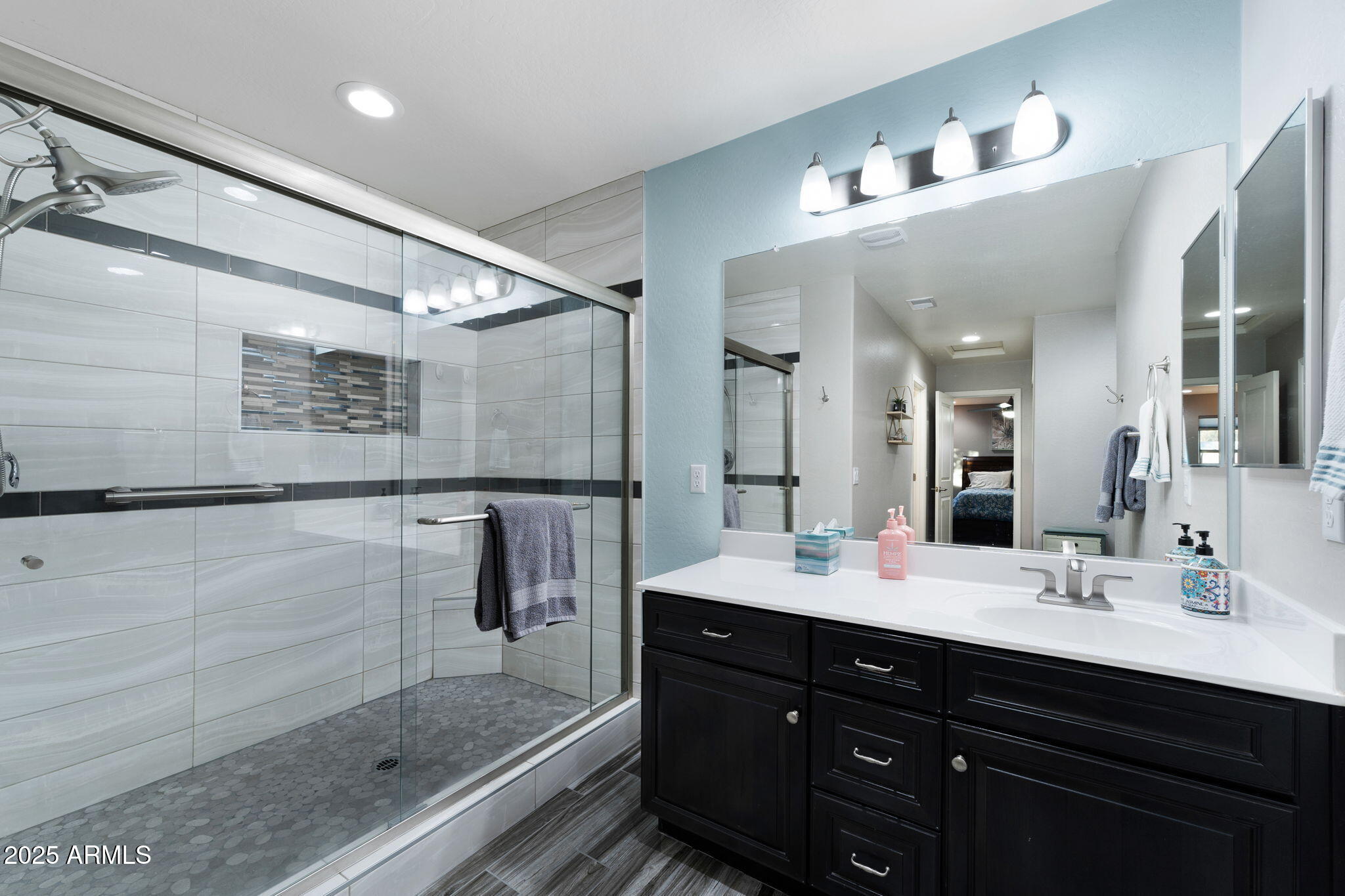 1755 East Mesquite Avenue Apache Junction, AZ 85119 - Photo 9 of 17 a bathroom with a double vanity sink and mirror