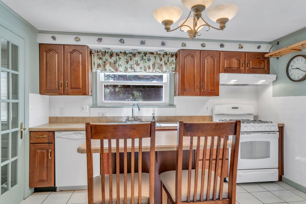1271 Plumtree Road Springfield, MA 01119 - Photo 11 of 41 a kitchen with granite countertop a sink and a stove