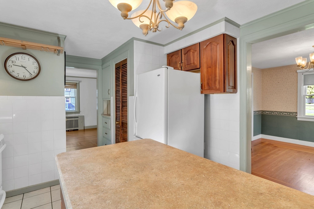 1271 Plumtree Road Springfield, MA 01119 - Photo 16 of 41 a bedroom with a bed and a chandelier