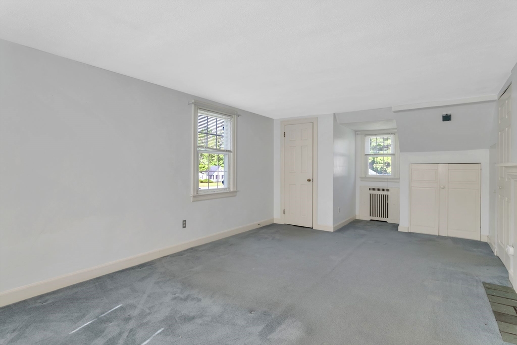 1271 Plumtree Road Springfield, MA 01119 - Photo 17 of 41 an empty room with windows and closet