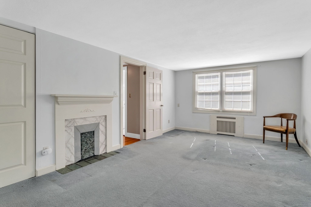 1271 Plumtree Road Springfield, MA 01119 - Photo 18 of 41 an empty room with windows and fireplace