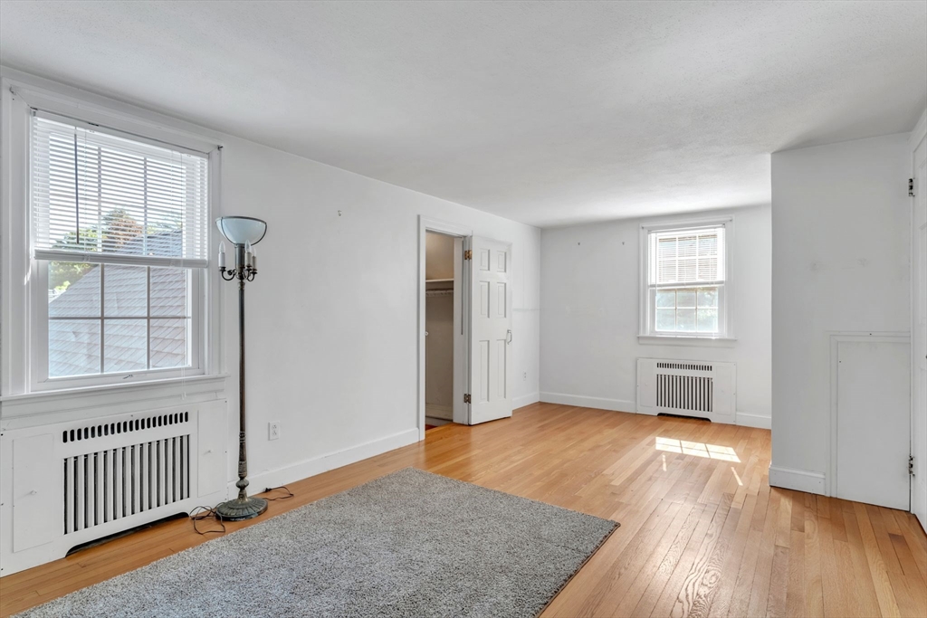1271 Plumtree Road Springfield, MA 01119 - Photo 21 of 41 an empty room with wooden floor and windows