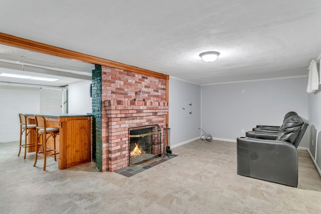 1271 Plumtree Road Springfield, MA 01119 - Photo 30 of 41 a livingroom with furniture and a fireplace