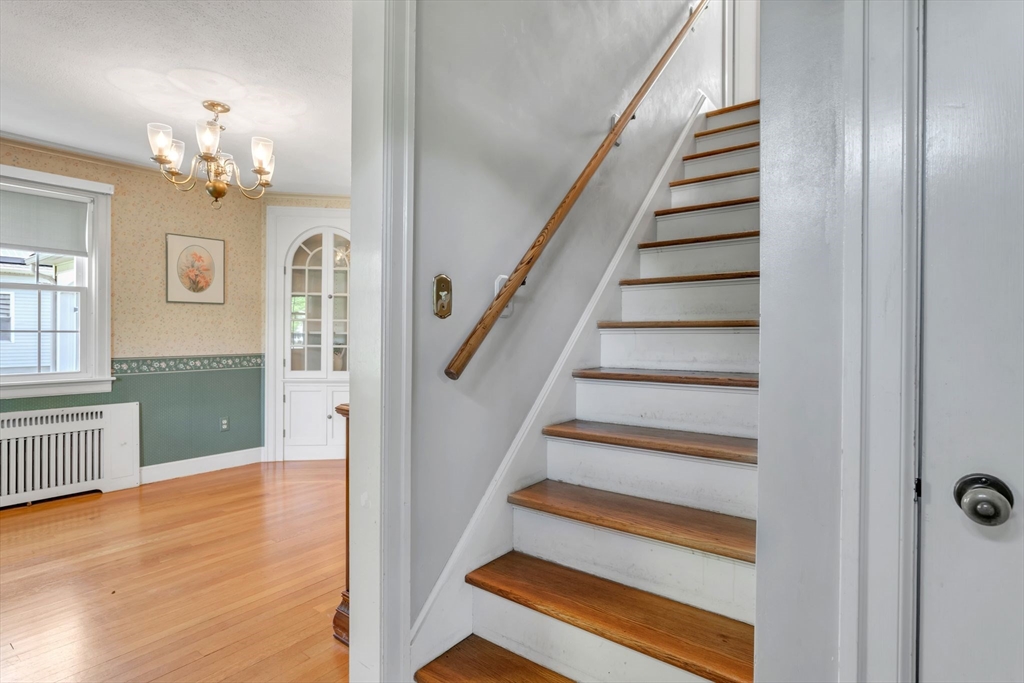 1271 Plumtree Road Springfield, MA 01119 - Photo 3 of 41 a view of a hallway with wooden floor and staircase