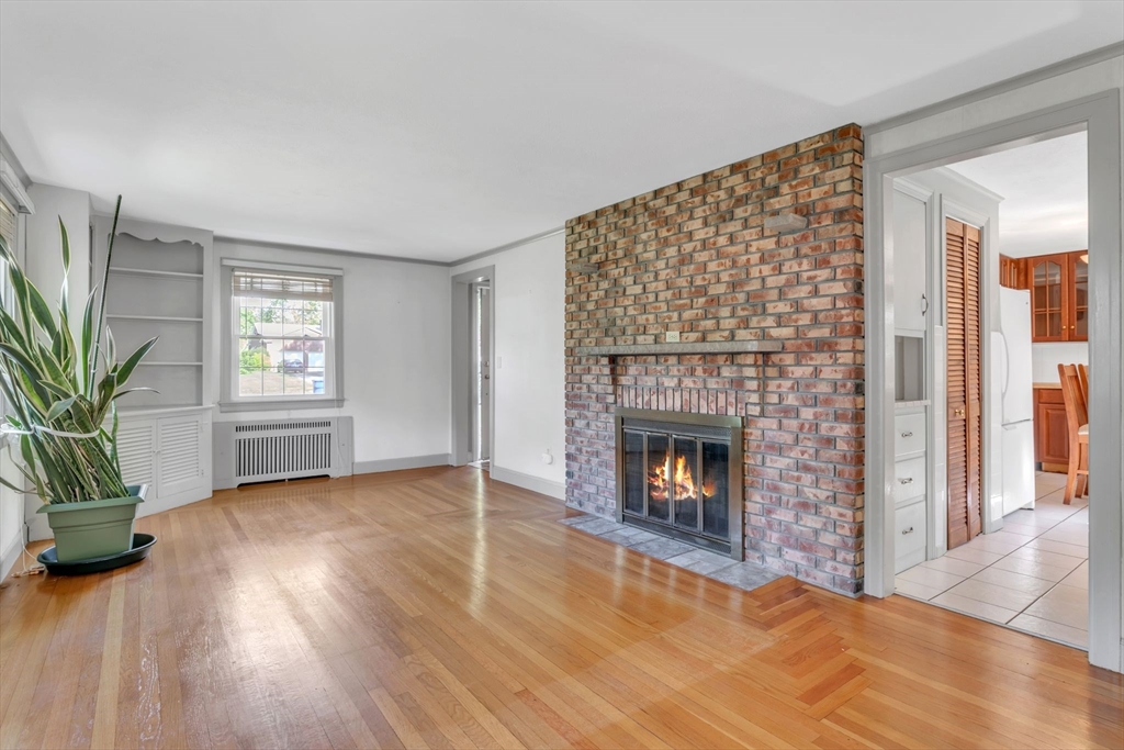 1271 Plumtree Road Springfield, MA 01119 - Photo 6 of 41 a view of an empty room with window and fire place