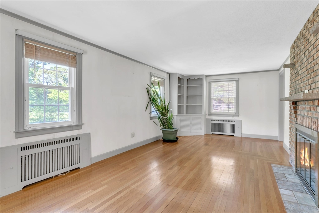1271 Plumtree Road Springfield, MA 01119 - Photo 7 of 41 wooden floor in an empty room with a window