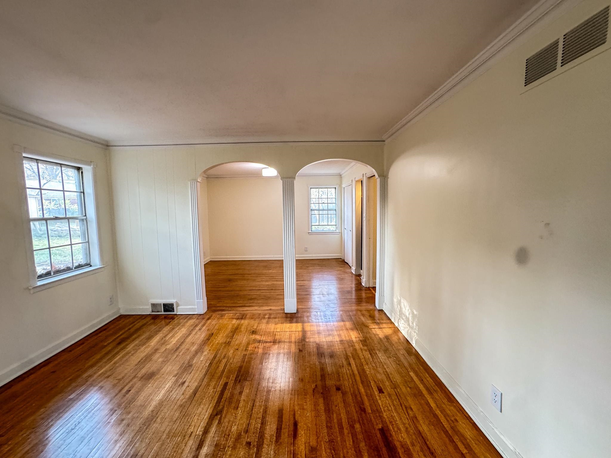 1345 Hickory Ridge Cove Memphis, TN 38116 - Photo 6 of 29 a view of empty room with wooden floor
