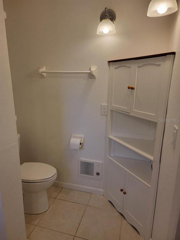 2215 Hontoon Road DeLand, FL 32720 - Photo 16 of 19 a bathroom with a toilet and a shower