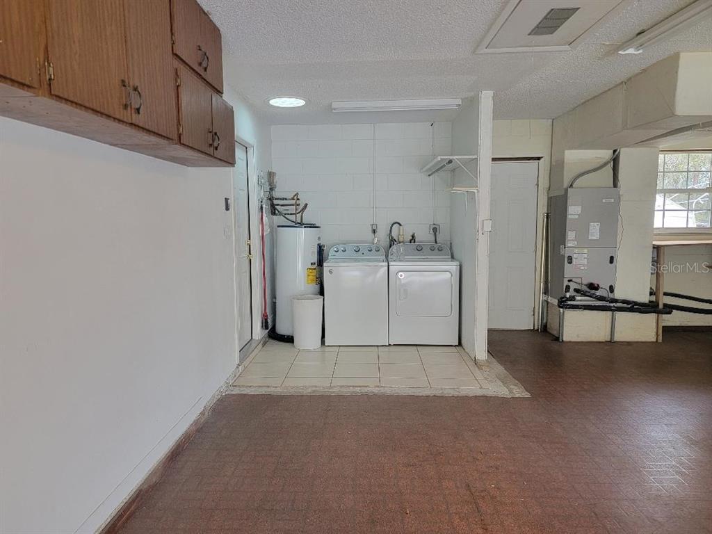 2215 Hontoon Road DeLand, FL 32720 - Photo 18 of 19 a view of a livingroom with a kitchen