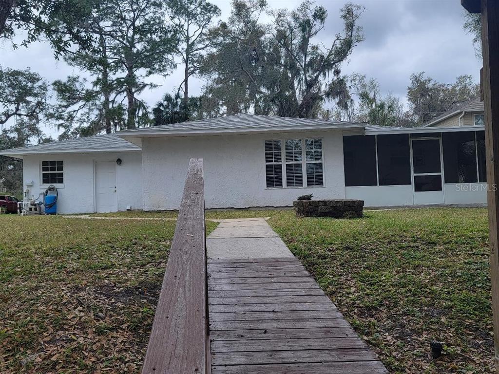 2215 Hontoon Road DeLand, FL 32720 - Photo 3 of 19 front view of a house with a yard