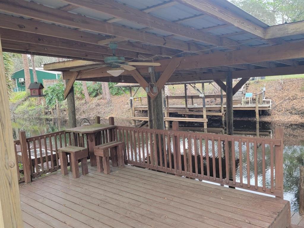 2215 Hontoon Road DeLand, FL 32720 - Photo 5 of 19 a view of a house with porch and wooden floor