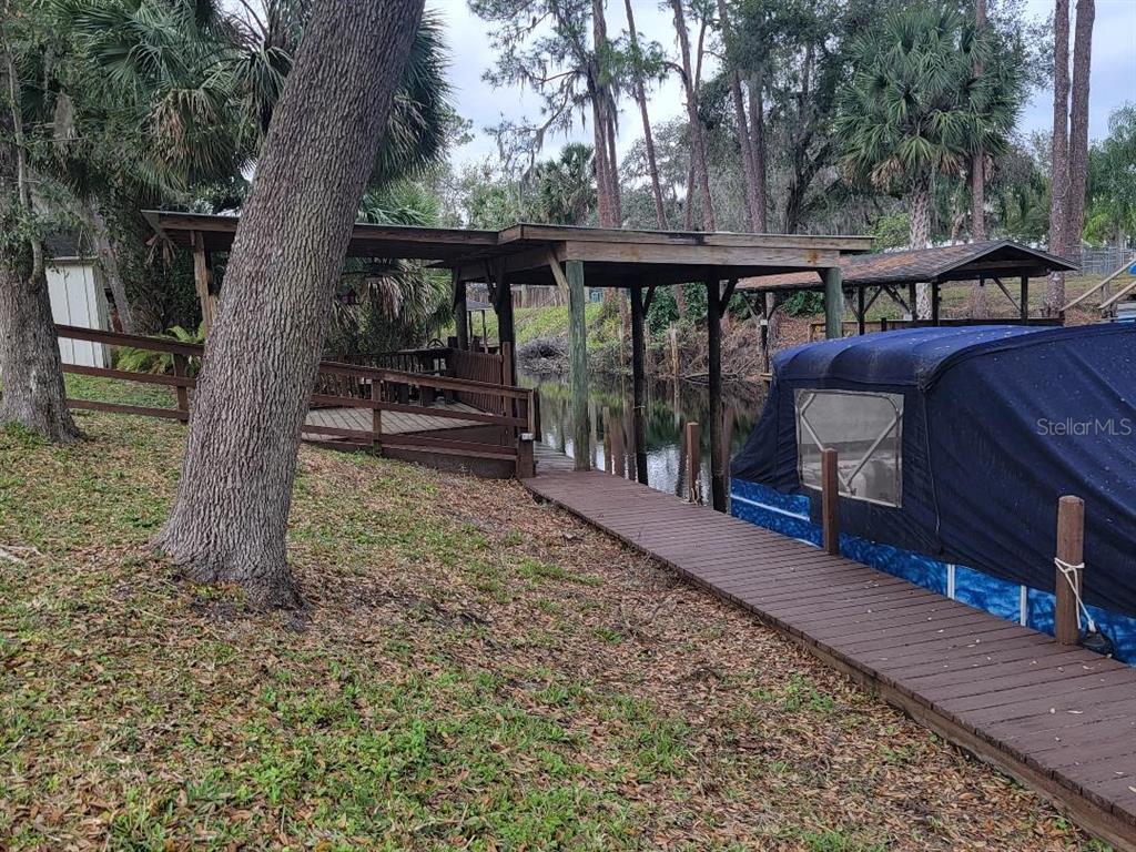 2215 Hontoon Road DeLand, FL 32720 - Photo 6 of 19 a view of a deck with a backyard