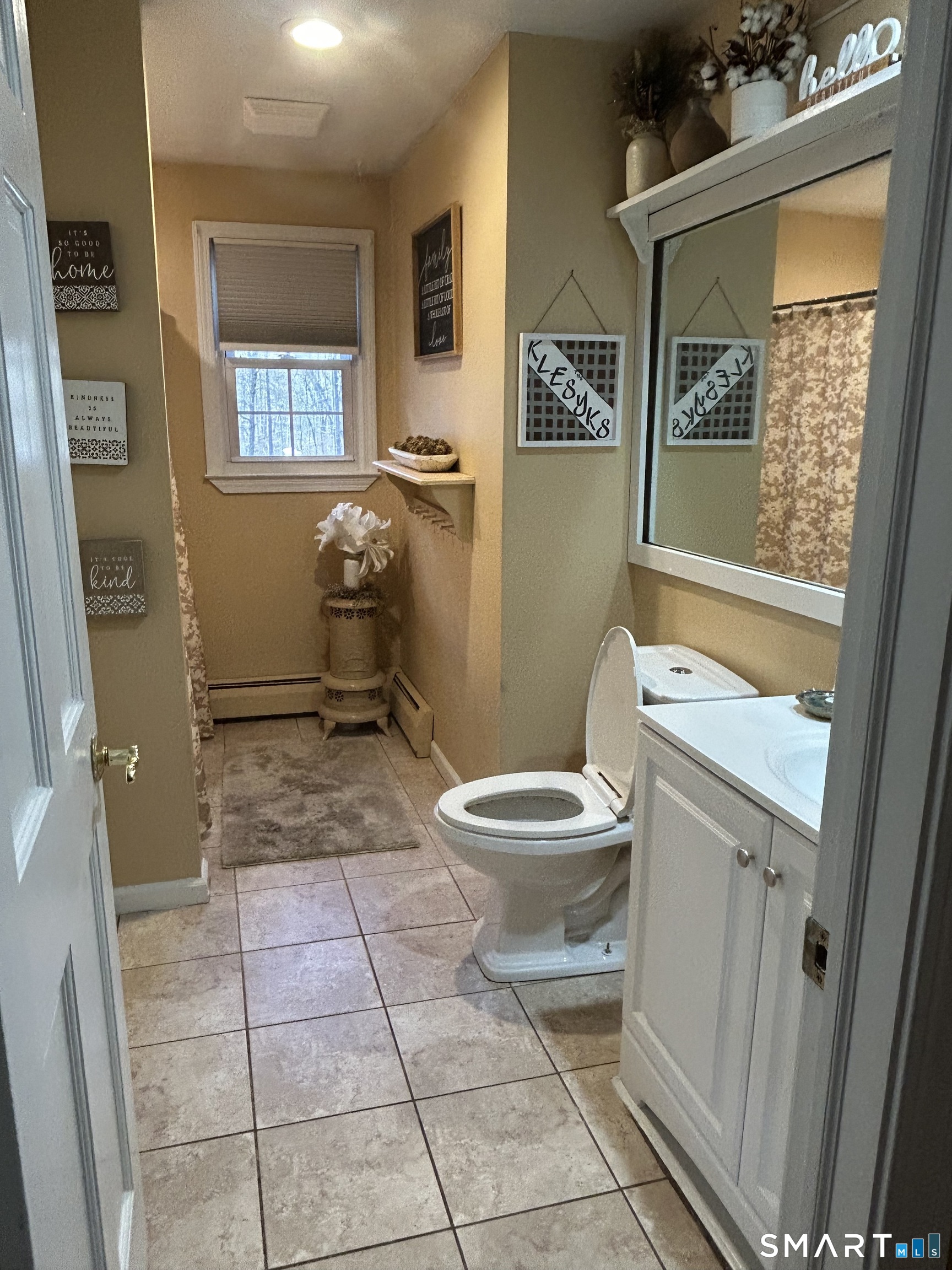 72 Nolan Road Hamden, CT 06514 - Photo 11 of 37 a bathroom with a toilet a sink and a mirror