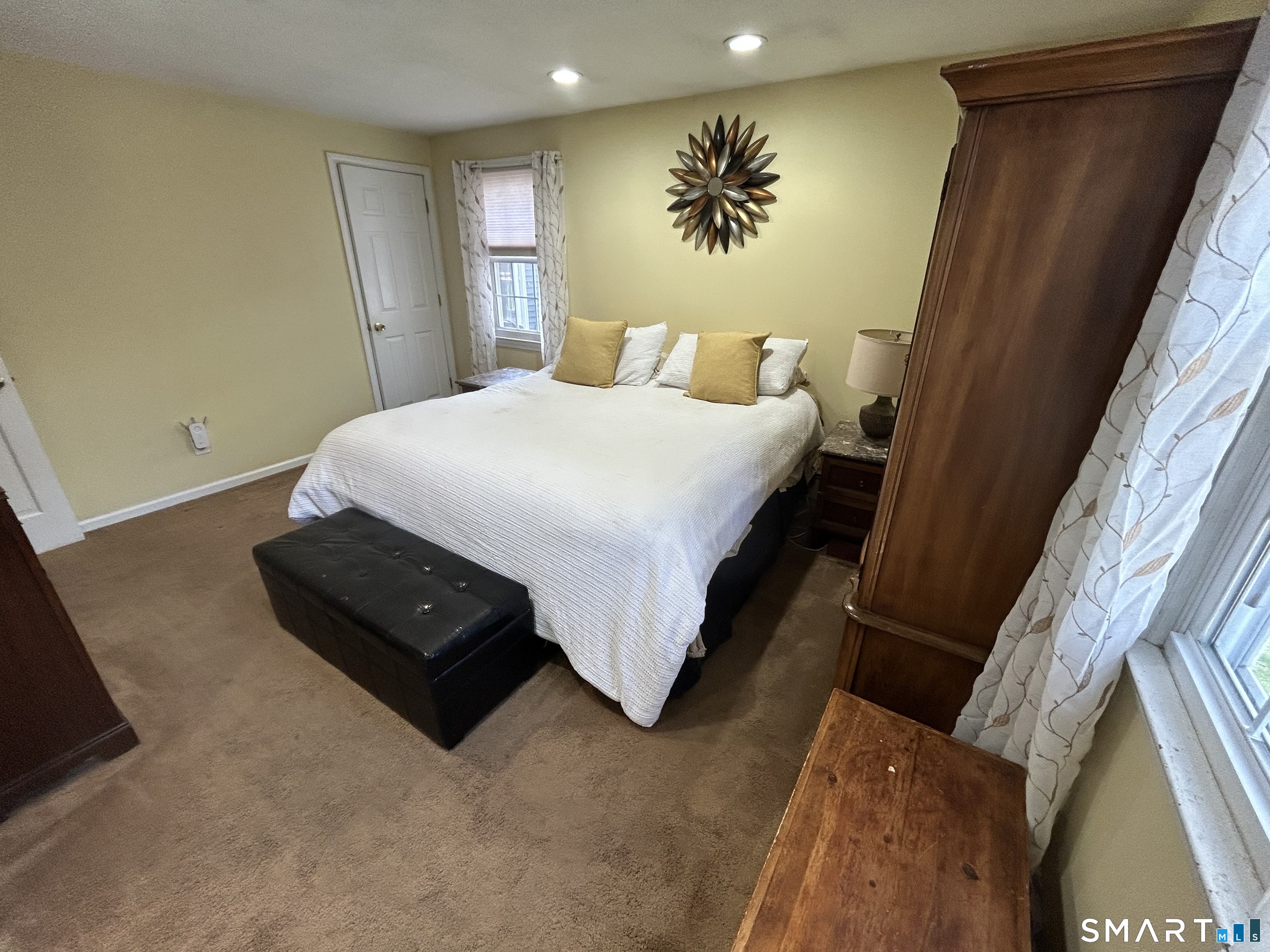 72 Nolan Road Hamden, CT 06514 - Photo 16 of 37 a bedroom with a bed and painting on the wall