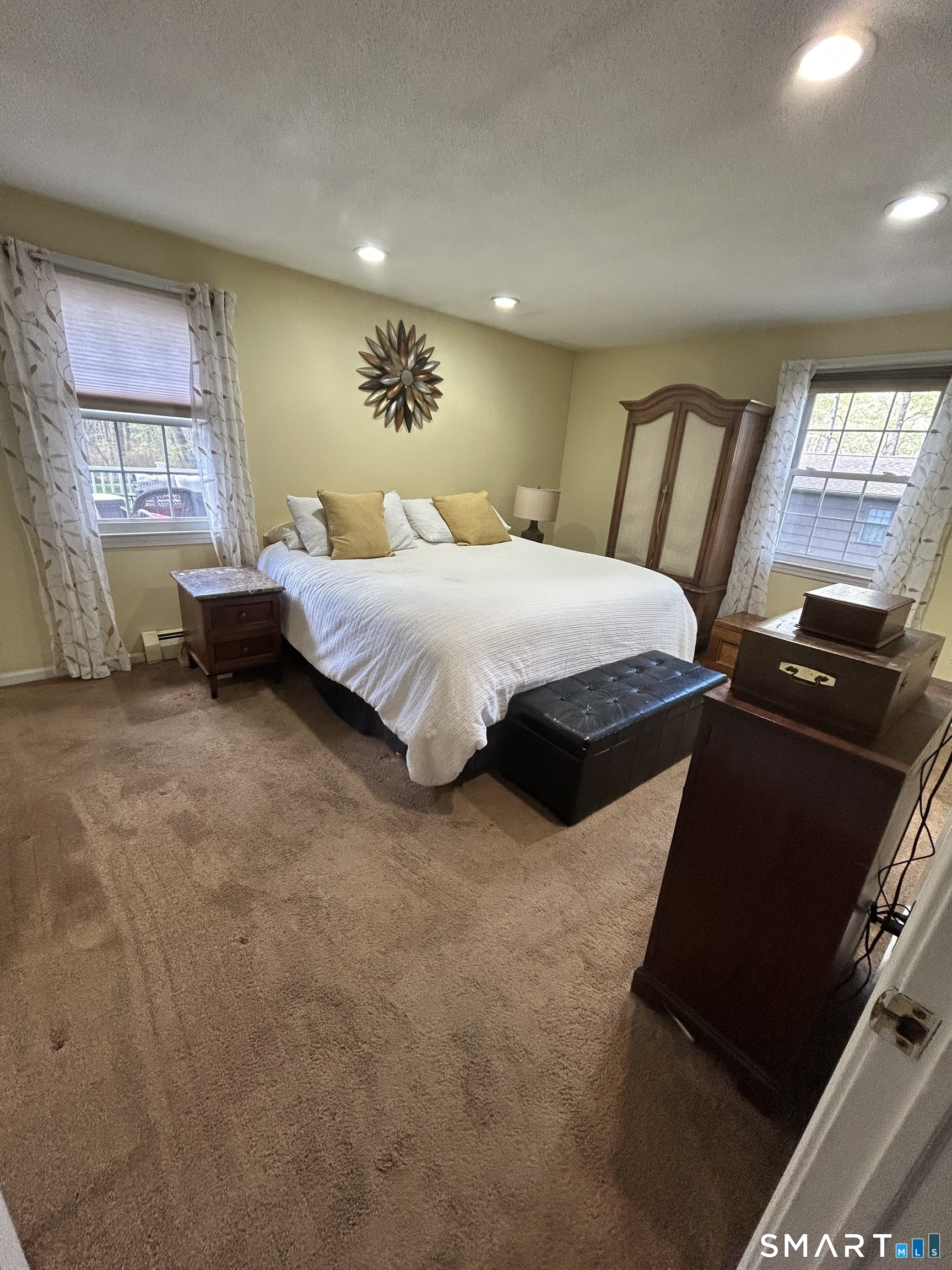72 Nolan Road Hamden, CT 06514 - Photo 17 of 37 a bedroom with a bed and wooden floor