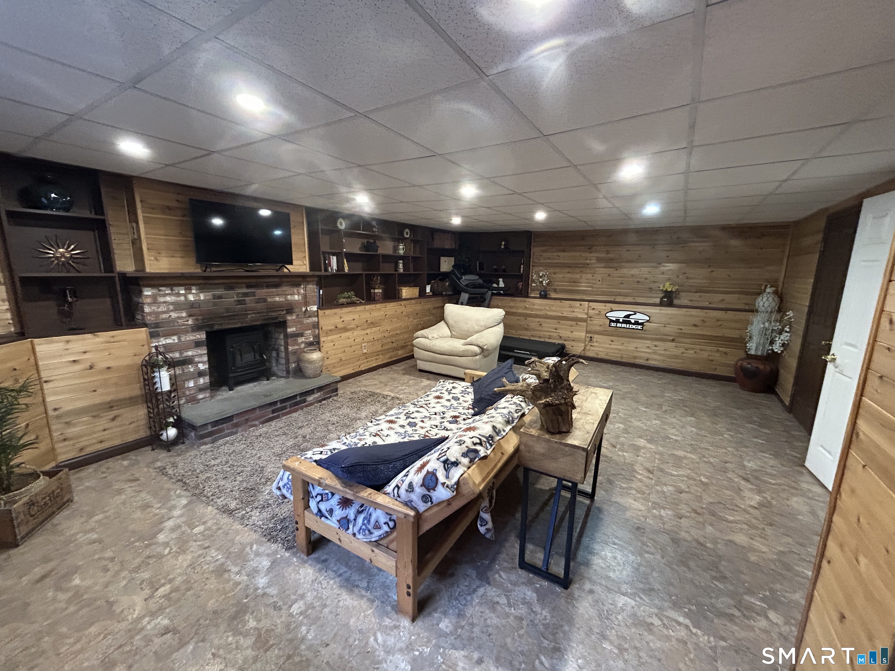 72 Nolan Road Hamden, CT 06514 - Photo 23 of 37 a living room with furniture and a fireplace