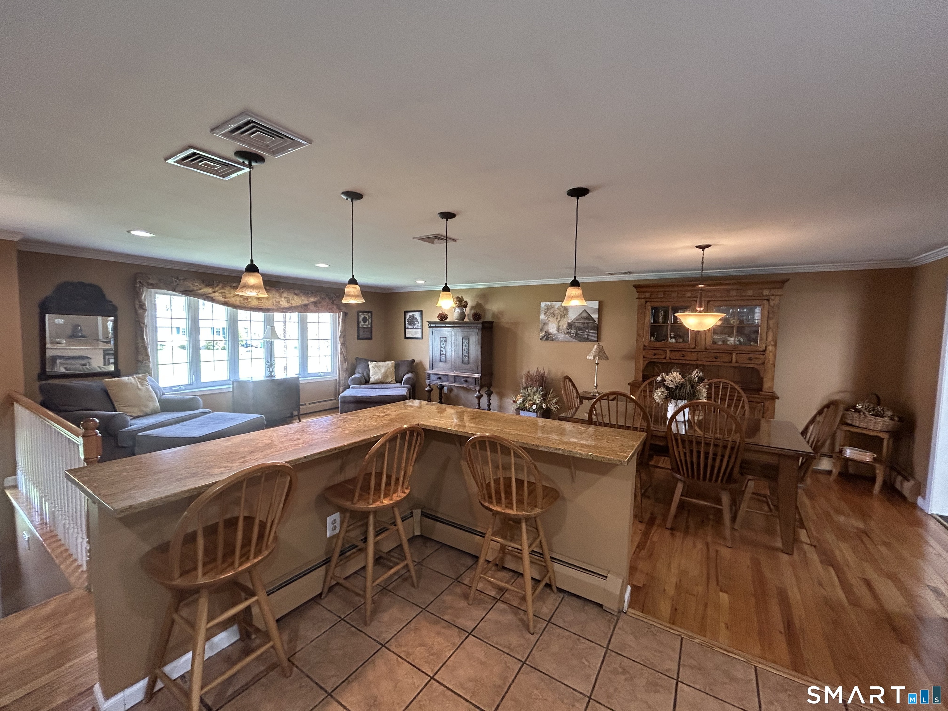 72 Nolan Road Hamden, CT 06514 - Photo 4 of 37 a kitchen with a sink a stove and chairs