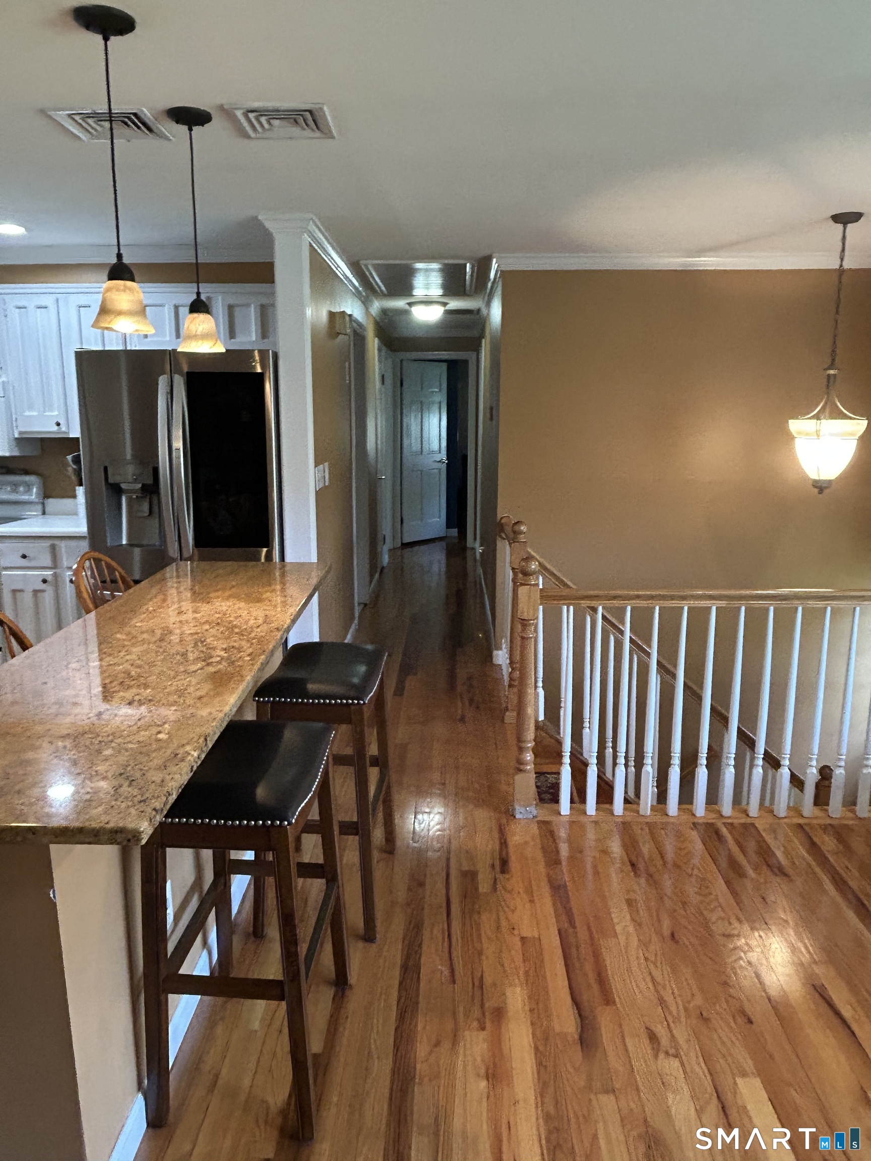 72 Nolan Road Hamden, CT 06514 - Photo 7 of 37 a view of a dining room with furniture and wooden floor