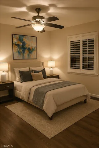 a bedroom with bed and a chandelier