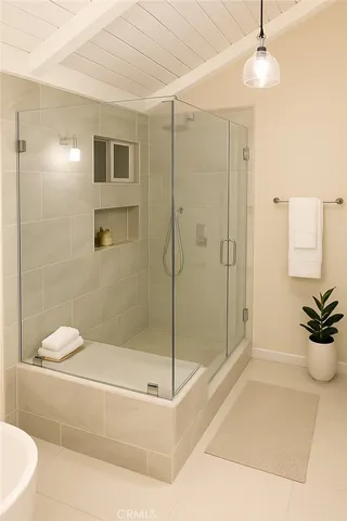 a bathroom with a shower a toilet and a shower