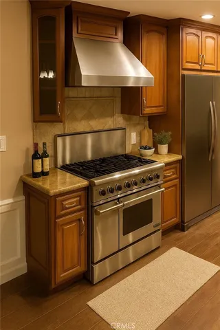 a stove top oven sitting inside of a kitchen