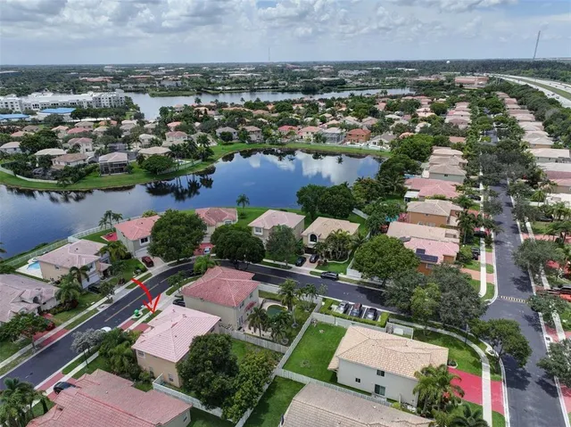 an aerial view of a house with a lake view